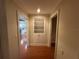 Hallway that features hardwood floors with built in shelving at 104 Woden Way, Winter Haven, FL 33884