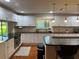 Well-equipped kitchen boasts modern appliances, sleek countertops, and a functional layout at 104 Woden Way, Winter Haven, FL 33884