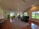 Spacious living room with vaulted ceilings, ample natural light, and hardwood floors at 104 Woden Way, Winter Haven, FL 33884