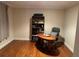 Home office with a wood desk and hardwood floors at 104 Woden Way, Winter Haven, FL 33884