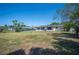 Spacious backyard providing plenty of room for outdoor enjoyment, with a view of the home's rear exterior at 109 Pasco Se Rd, Winter Haven, FL 33884