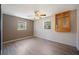 A bedroom with wood-look floors, a ceiling fan, and a built-in wooden display cabinet at 109 Pasco Se Rd, Winter Haven, FL 33884