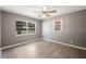 Inviting bedroom with light-filled windows and wood-look flooring offers a peaceful retreat at 109 Pasco Se Rd, Winter Haven, FL 33884