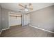 A cozy bedroom featuring a ceiling fan and a closet for ample storage space at 109 Pasco Se Rd, Winter Haven, FL 33884