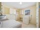 Functional laundry room with essential appliances and storage solutions at 109 Pasco Se Rd, Winter Haven, FL 33884