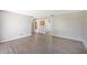 Spacious living room with modern flooring and neutral paint, offering a versatile living space at 109 Pasco Se Rd, Winter Haven, FL 33884