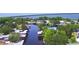 A serene aerial view of lakefront homes, featuring lush greenery and calm waterways at 117 Bream St, Haines City, FL 33844