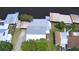 High-angle aerial view of the property showcasing its roofline and waterfront access at 117 Bream St, Haines City, FL 33844