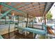 The covered boat dock area features a wooden pier, waterfront views, and shelter for your watercraft at 117 Bream St, Haines City, FL 33844