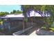 Waterfront view featuring a covered boat dock, offering shade and shelter, with access to the open water at 117 Bream St, Haines City, FL 33844