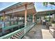 View of a covered boat dock with a metal roof and lattice trim, offering convenient access to the water at 117 Bream St, Haines City, FL 33844