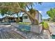 The exterior view showcases a low wall and a beautiful, mature tree, providing shade and character to the property at 117 Bream St, Haines City, FL 33844