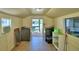 Laundry room with washer, dryer, shelving and lots of storage space at 117 Bream St, Haines City, FL 33844