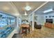 Open-concept living space with dining area, bedroom, and comfortable seating area at 117 Bream St, Haines City, FL 33844