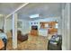 Open living area with a bedroom, living room, and part of the kitchen visible at 117 Bream St, Haines City, FL 33844