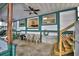 Spacious covered patio with stairs, offering ample seating and a relaxing outdoor space at 117 Bream St, Haines City, FL 33844