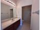 Bathroom with a vanity, framed mirror, and an open walk-in shower at 1224 Vienna Square Dr, Winter Haven, FL 33884