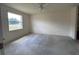 Spacious bedroom featuring natural light from the large window and a ceiling fan at 1224 Vienna Square Dr, Winter Haven, FL 33884