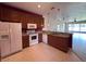 Functional kitchen featuring updated counters and appliances with seamless connection to the living area at 1224 Vienna Square Dr, Winter Haven, FL 33884