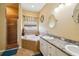 Luxurious bathroom featuring a soaking tub, separate shower, and double sink vanity at 132 Dinner Lake Ave, Lake Wales, FL 33859