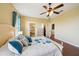 Spacious primary bedroom with wood floors, en suite bathroom, and walk-in closet at 132 Dinner Lake Ave, Lake Wales, FL 33859