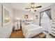 A bedroom with neutral paint, white furniture, and a window at 132 Dinner Lake Ave, Lake Wales, FL 33859