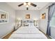 A bedroom with neutral paint, white furniture, and a view of the bed at 132 Dinner Lake Ave, Lake Wales, FL 33859