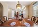 Spacious dining area featuring a large wooden table and an open layout to the living area at 132 Dinner Lake Ave, Lake Wales, FL 33859
