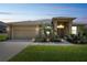 Charming single-story home featuring a well-manicured lawn, a two-car garage, and inviting front entryway at 132 Dinner Lake Ave, Lake Wales, FL 33859