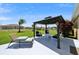 An inviting gazebo in the backyard, complete with stylish seating and a tranquil atmosphere at 132 Dinner Lake Ave, Lake Wales, FL 33859