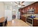 Well-equipped kitchen with stainless steel appliances and a view to the dining area at 132 Dinner Lake Ave, Lake Wales, FL 33859