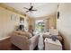 Living room with hardwood floors and a sliding glass door out to the lanai at 132 Dinner Lake Ave, Lake Wales, FL 33859