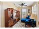 Comfortable living room with a plush blue sectional sofa and a large entertainment center at 132 Dinner Lake Ave, Lake Wales, FL 33859