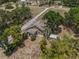 Aerial view of home showing the roof and treed landscape at 134 Masterpiece Rd, Lake Wales, FL 33898