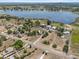 Expansive aerial shot showcasing a home's prime location near a tranquil lake and scenic landscapes at 134 Masterpiece Rd, Lake Wales, FL 33898