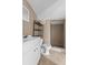 Cozy bathroom with neutral tile, walk-in shower, and vanity at 134 Masterpiece Rd, Lake Wales, FL 33898