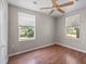 Bedroom featuring a ceiling fan and natural light from two windows at 134 Masterpiece Rd, Lake Wales, FL 33898