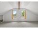 A bedroom space enhanced by a view of the yard through windows at 134 Masterpiece Rd, Lake Wales, FL 33898