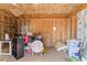 Unfinished garage interior with exposed wood framing and insulation at 134 Masterpiece Rd, Lake Wales, FL 33898