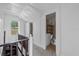 Hallway with carpet and a partial view of a bathroom at 134 Masterpiece Rd, Lake Wales, FL 33898