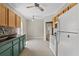 Well-lit kitchen with tile floors and white appliances at 134 Masterpiece Rd, Lake Wales, FL 33898