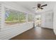 Enclosed porch with white siding and multiple windows providing natural light at 134 Masterpiece Rd, Lake Wales, FL 33898