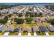 Aerial view of a residential area showcasing the property's location near a lake at 135 Eloise Oaks Dr, Winter Haven, FL 33884