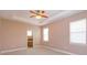 Neutral bedroom with carpet flooring, a ceiling fan, and natural light at 135 Eloise Oaks Dr, Winter Haven, FL 33884