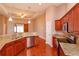 Modern kitchen with stainless steel appliances, granite countertops, and breakfast bar at 135 Eloise Oaks Dr, Winter Haven, FL 33884