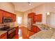 Bright kitchen with stainless steel appliances, granite counters, and a breakfast bar at 135 Eloise Oaks Dr, Winter Haven, FL 33884