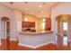 Open kitchen featuring granite countertops, wood cabinets, and stainless steel appliances at 135 Eloise Oaks Dr, Winter Haven, FL 33884