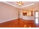 Bright living room with hardwood floors and kitchen access at 135 Eloise Oaks Dr, Winter Haven, FL 33884