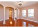 Spacious living room showcasing hardwood floors, neutral paint, and natural light at 135 Eloise Oaks Dr, Winter Haven, FL 33884