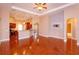 Open-concept living area with hardwood floors and a view of the kitchen at 135 Eloise Oaks Dr, Winter Haven, FL 33884
